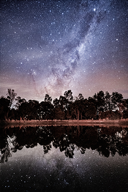 The Milky Way galactic core reflected by the dark waters of Blue Lake at Grampians Paradise Camping and Caravan Parkland